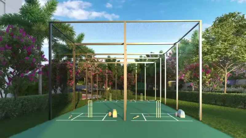 Practice cricket pitch with net cage at Suraksha Whispering Waves, Begur